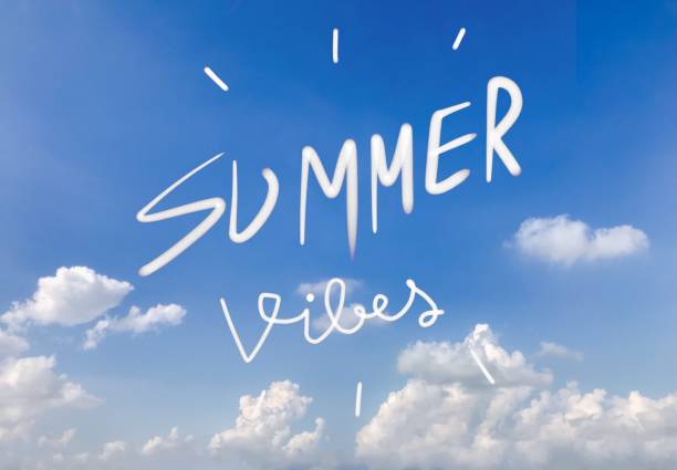 istock Summer vibes handwriting on blue sky background 963929584