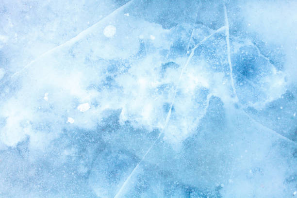 istock texture of a beautiful blue ice with cracks 963938688