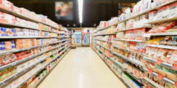 istock supermarket aisle interior blurred background 963938896