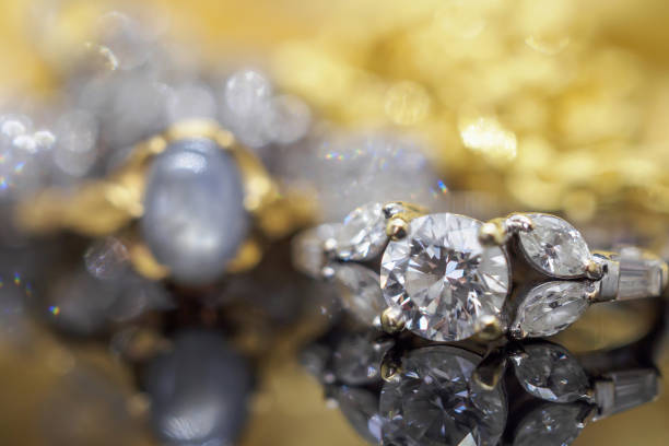 istock Luxury gold Jewelry diamond rings with reflection on black background 963939236