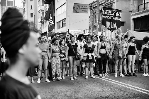 São Paulo, SP, Brazil - March 18, 2018: Women marching during a feminist act on Avenida Paulista