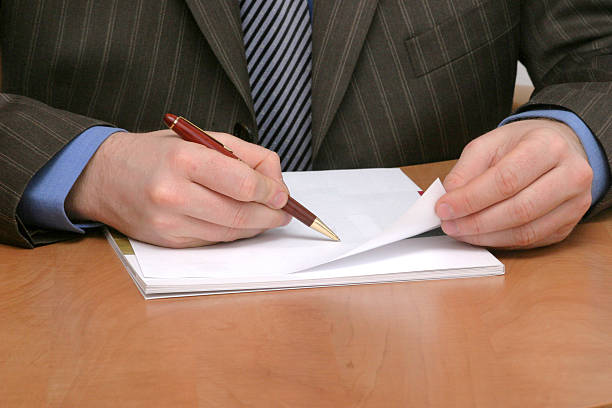 istock businessman writing on blank paper 96395922