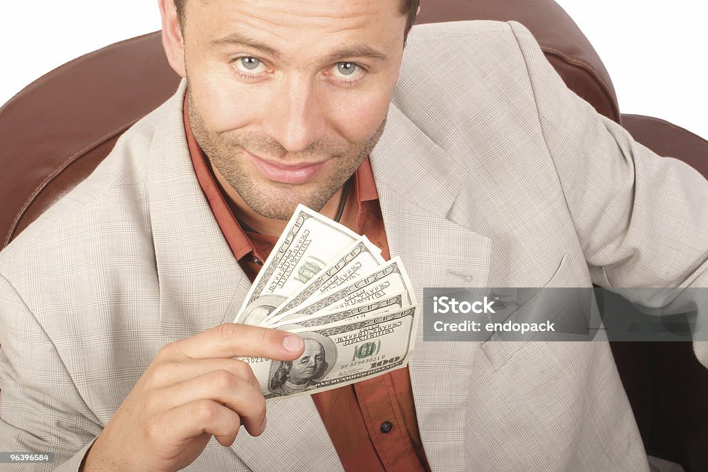 Uomo sorridente con poche houndred dollari banconote in mano - Foto stock royalty-free di Adulto