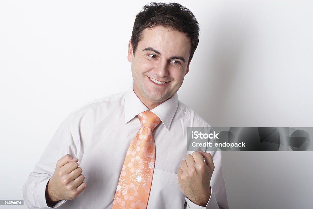 Joven sonriente hombre de negocios mostrando fists - Foto de stock de Actividad móvil general libre de derechos