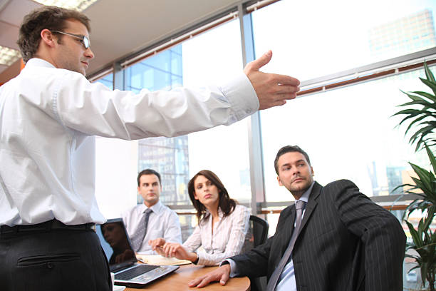 istock Man speaks in front of colleagues 96397315