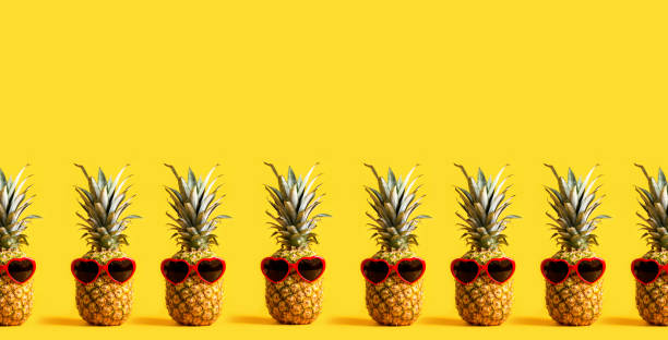 istock Series of pineapples wearing sunglasses 964005644