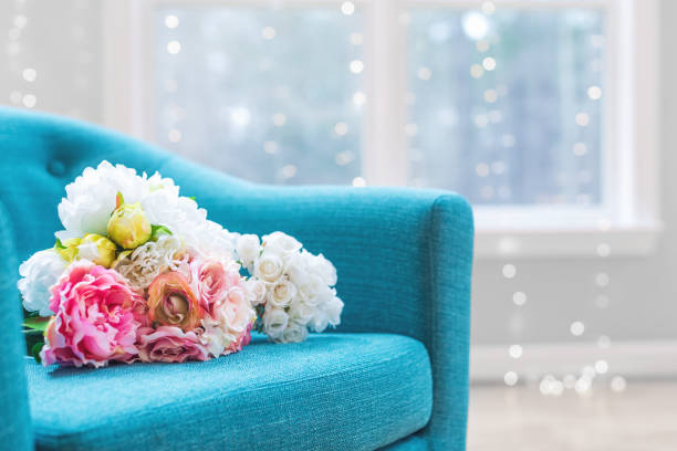 istock Flower bouquets in luxury home with turquoise chair 964005682
