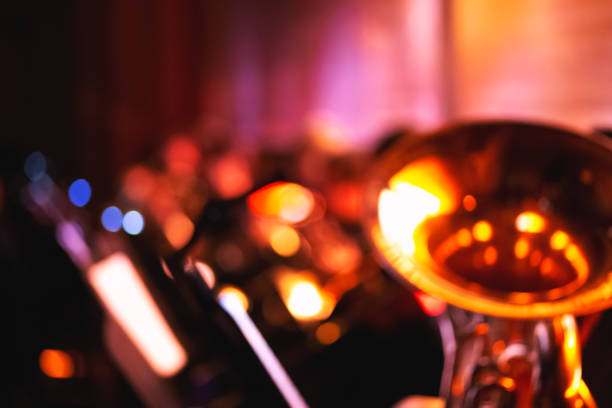 Abstract blurred symphony orchestra background Abstract blurred symphony orchestra background with tuba abstract musical instrument stock pictures, royalty-free photos & images