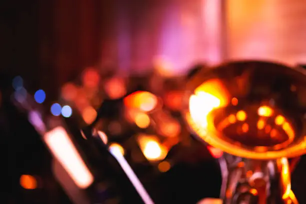Abstract blurred symphony orchestra background with tuba