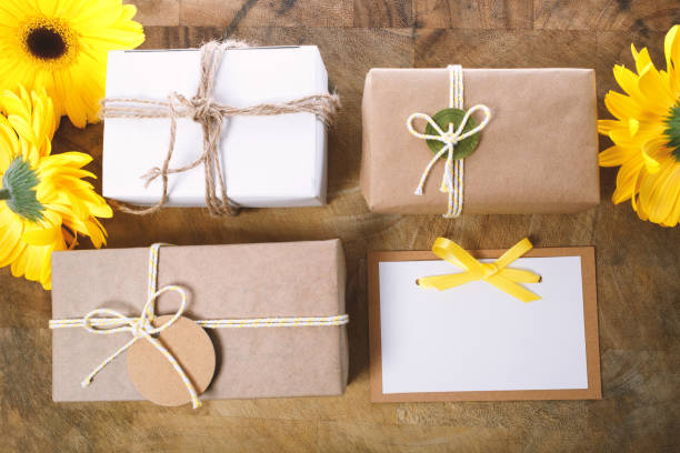 istock Little gift boxes with with yellow flowers 964005754