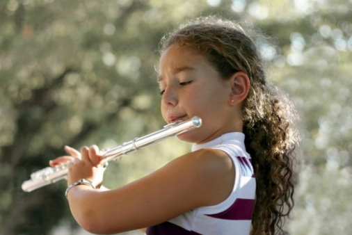 Young Woman Playing the Flute , Musician , Entertainment Culture