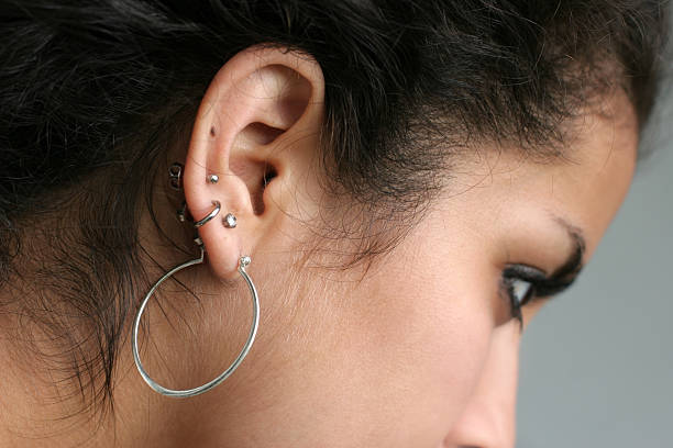 Ear piercing stock photo