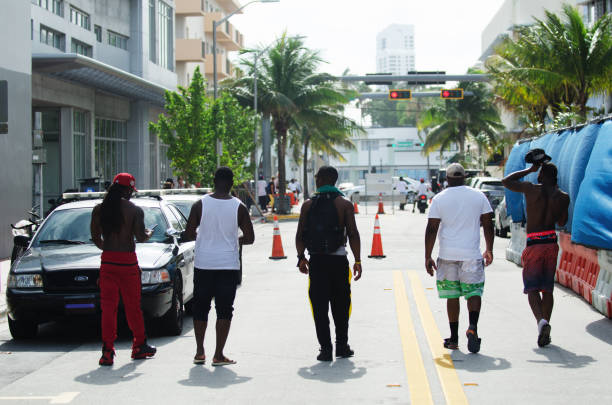 Miami - May 27, 2017: Young people flock to Ocean Drive in South Beach to celebrate the annual Urban Beach Week, a contentious event that attracts a heavy police presence during Memorial Day Weekend.