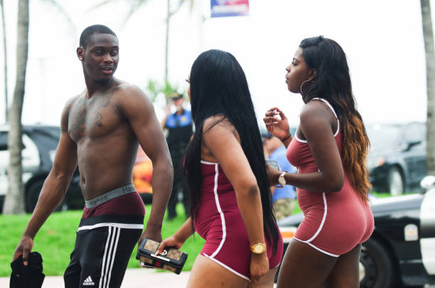 Miami - May 27, 2017: Young people flock to Ocean Drive in South Beach to celebrate the annual Urban Beach Week, a contentious event that attracts a heavy police presence during Memorial Day Weekend.