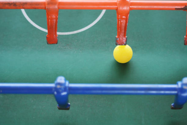 istock Soccer table game, blue foosball player. 964021322