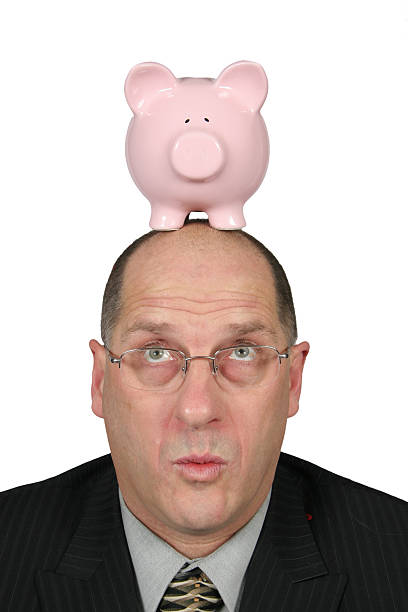 istock Business Man with Piggy Bank on head 96402909