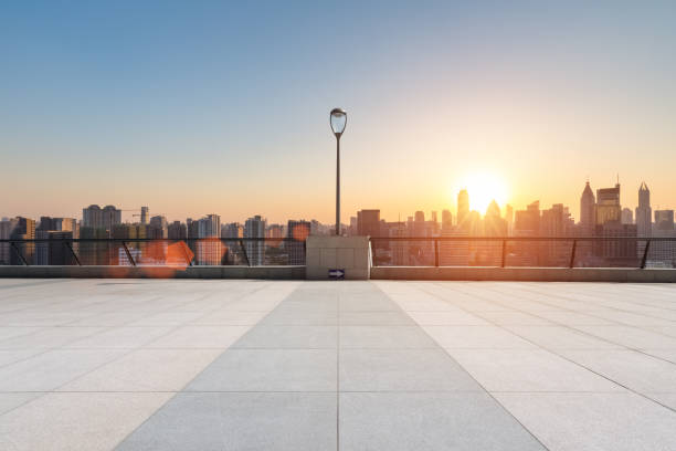 istock empty floor in sunset with skyline and buildings 964033896