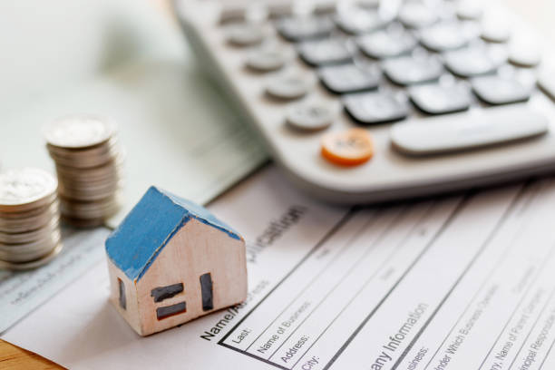 istock Home insurance form with money,passbook  and calculator. 964034444