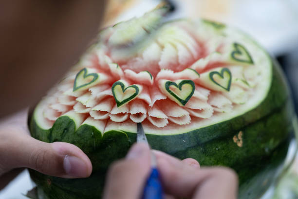 Carved fruit show step. Thailand. Thai fruit carving is a traditional. Thai art that requires neatness, precision, meditation, and personal ability. Fruit carving persisted in Thailand as a respected art for centuries. fruit carving stock pictures, royalty-free photos & images