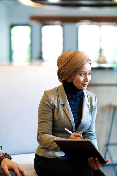 istock Muslim Woman in Diverse Creative Team Discussing Ideas 964050478
