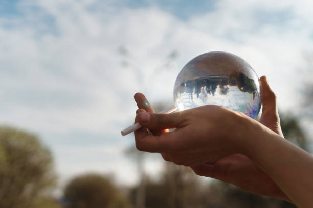 istock Contact juggling. Hand, acrylic ball and cigarette 964050484