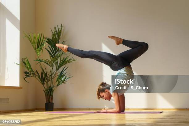 Young Fit Woman Doing Stretching Exercise Stock Photo - Download Image Now - Handstand, Acrobatic Activity, Active Lifestyle