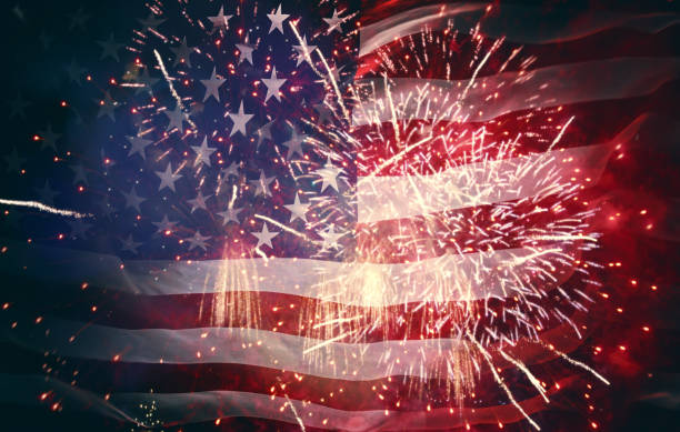 istock American flag on background of fireworks. 964058788
