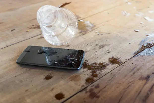 water spilled on mobile phone
