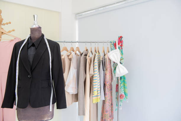 istock Clothing rack with woman cloth hanging on it. 964062638