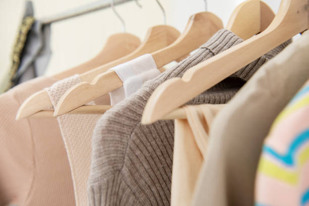 istock Clothing rack with woman cloth hanging on it. 964062640