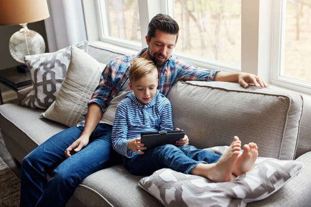 istock Introducing his son to the wide world online 964065142