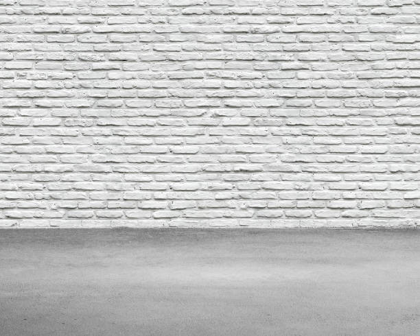 istock Room interior with white brick wall and concrete floor 964068014