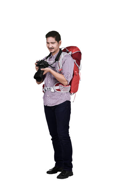 istock Portrait of asian tourist with backpack and camera 964068358