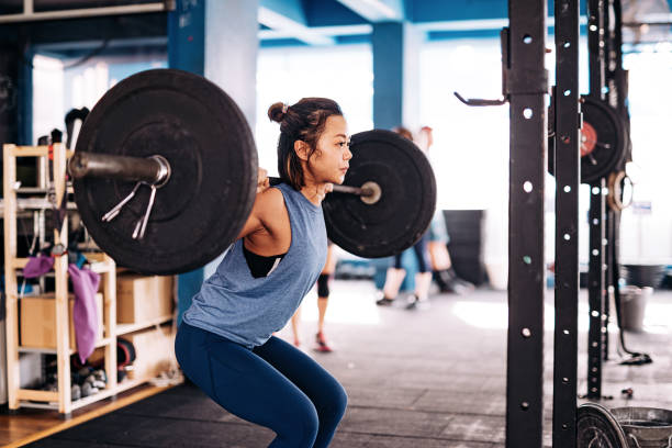 Cross training and weight lifting Cross training with multi ethnic people who are different in age and physical readiness. Willpower and determination push the sweat over their bodies as trainings are getting harder weightlifting stock pictures, royalty-free photos & images