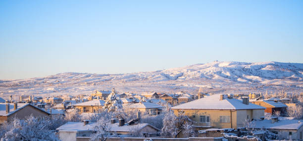 istock snow landscape and snowdrift on building and trees in parks 964076968
