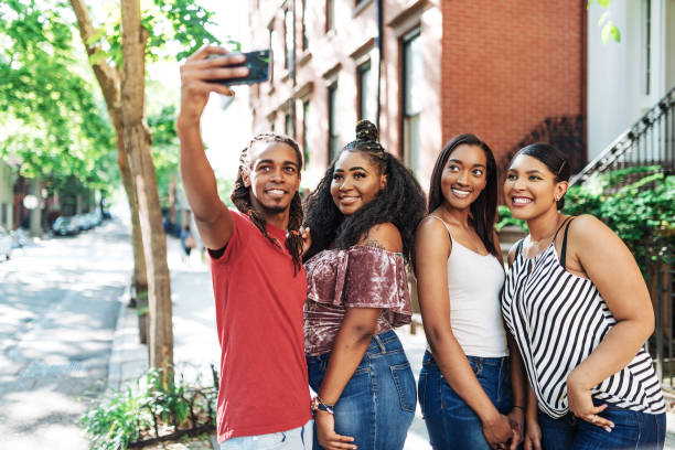 istock Young travelers on city break taking selfie in Lower Manhattan 964079366
