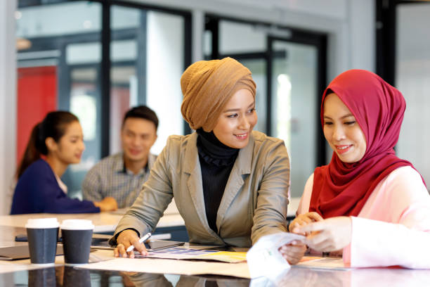 istock Two Creative Muslim Women Discussing Ideas 964079684