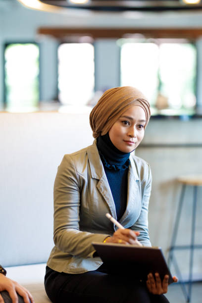 istock Muslim Woman in Diverse Creative Team Discussing Ideas 964079772