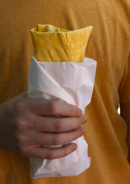 istock falafel with vegetables lavash vegan wrap in hand 964079966