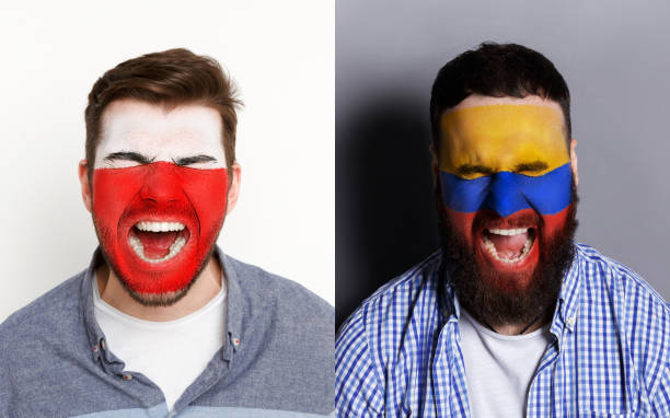 Emotional soccer fans with painted flags on faces
