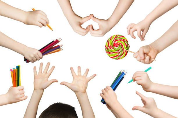 istock Set of child hands with pencils, lollipop 964090788
