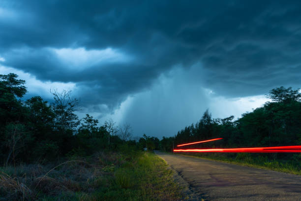 istock The road that leads to the falling rain from the thick Nimbus cloud 964091036