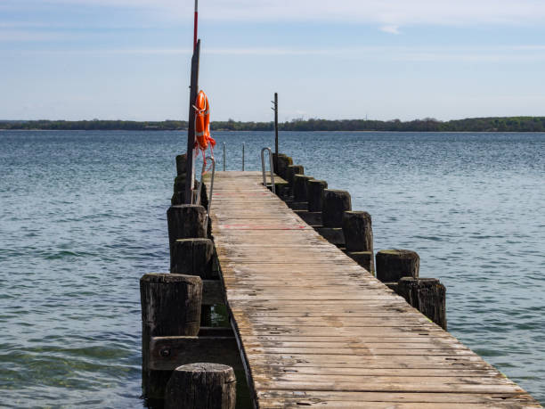 istock Boat landing stage with rescue ring and rescue pole 1 964091650