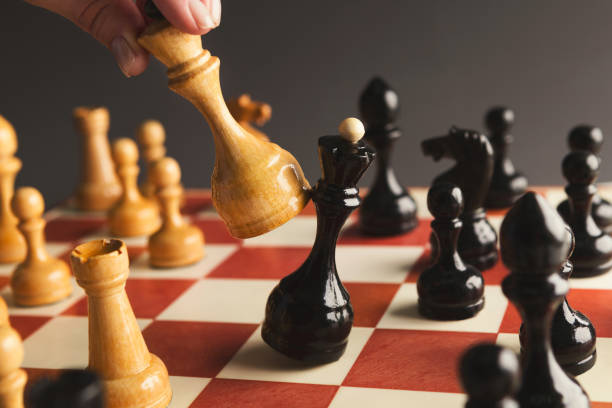 istock Hand of player chess board game putting white pawn 964091684