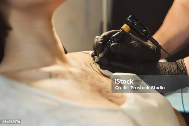 Tattoo Artist Working With Needle On Clients Body Stock Photo - Download Image Now - Tattoo Machine, Adult, Adults Only