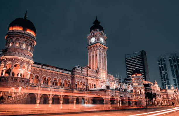 istock famous place building sultan abdul samad clock tower during dusk with light trail in kuala lumpur 964098378