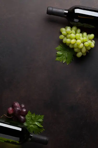 Wine bottles and grapes. Top view with space for your text