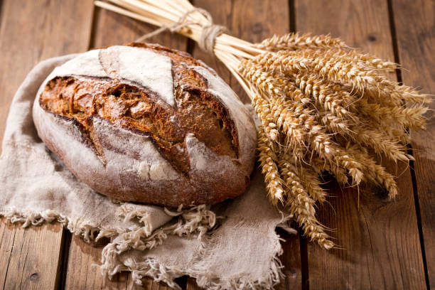 istock Fresh baked bread with wheat ears 964119836
