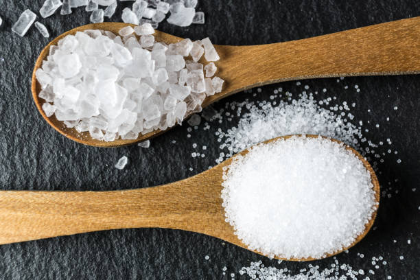 istock Different types of salt. Top view on two wooden spoons 964126534