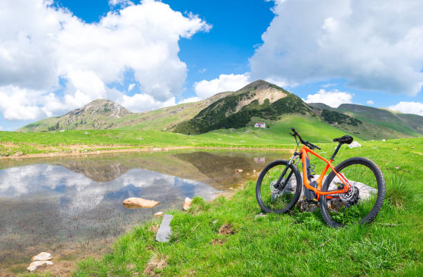 istock Mountain ebike stops near an alpine lake in spring 964129336
